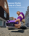 Creator holding TELESIN StreetGrip Kit for Action 6 while filming a city street vlog